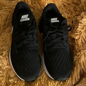 Nike black and white womens sneaks . Worn once .Perfect condition.